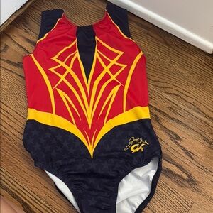 GK Elite Red, Blue, and Yellow Supergirl Gymnastics Leotard Jordan Chiles